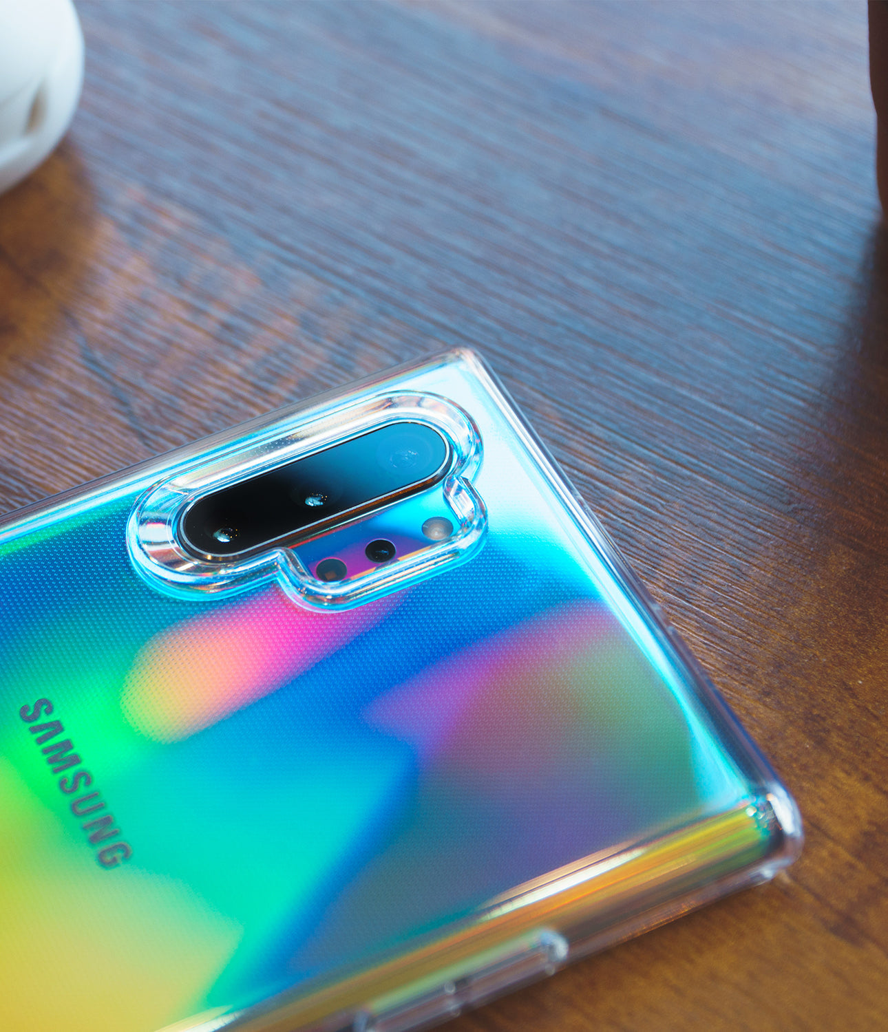 Galaxy Note 10 Plus Case | Air - Clear (Dot) - Iridescent Galaxy Note 10 Plus in a clear dotted case on wood.