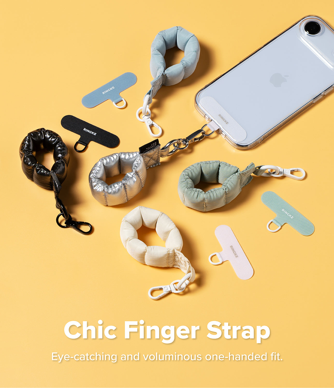 Holder Link Puffer | Finger - Colorful, puffy ring-shaped phone straps with matching adhesive anchor tabs on a yellow background.