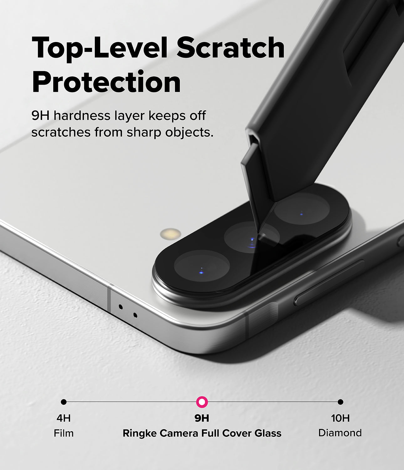 Galaxy A37 / A57 5G | Camera Glass 2P - A utility knife blade scrapes against a smartphone camera lens protector.