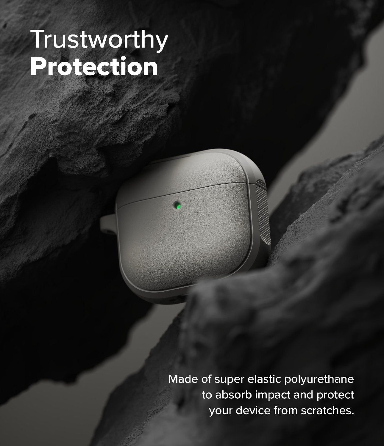 AirPods 4 Case | Onyx Magnetic - Grey AirPods 4 case with a glowing green light nestled between dark, rugged rock formations.