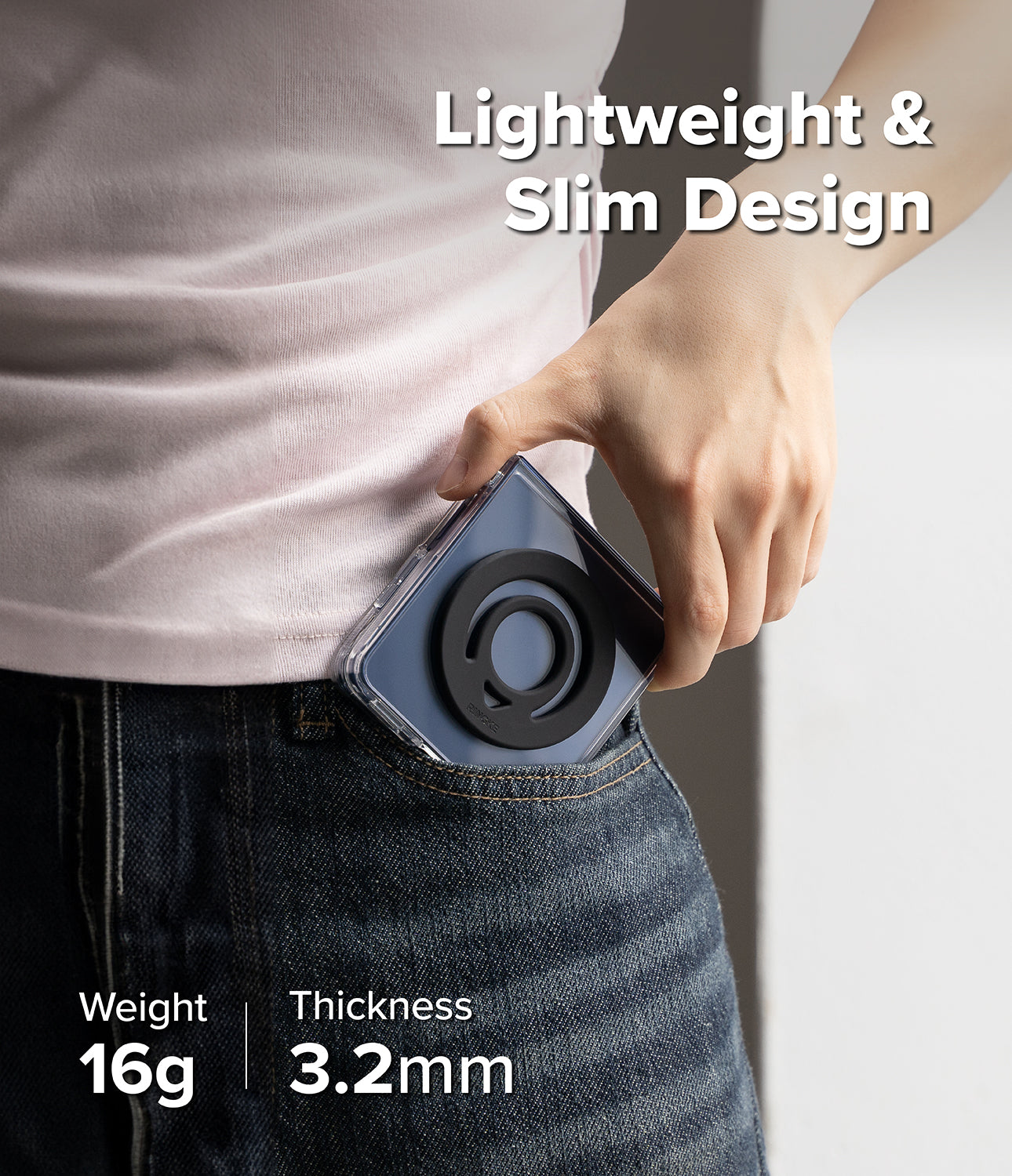 Dual Magnetic Silicone Ring - A hand slides a phone with a black magnetic ring into a jeans pocket, highlighting slim design.