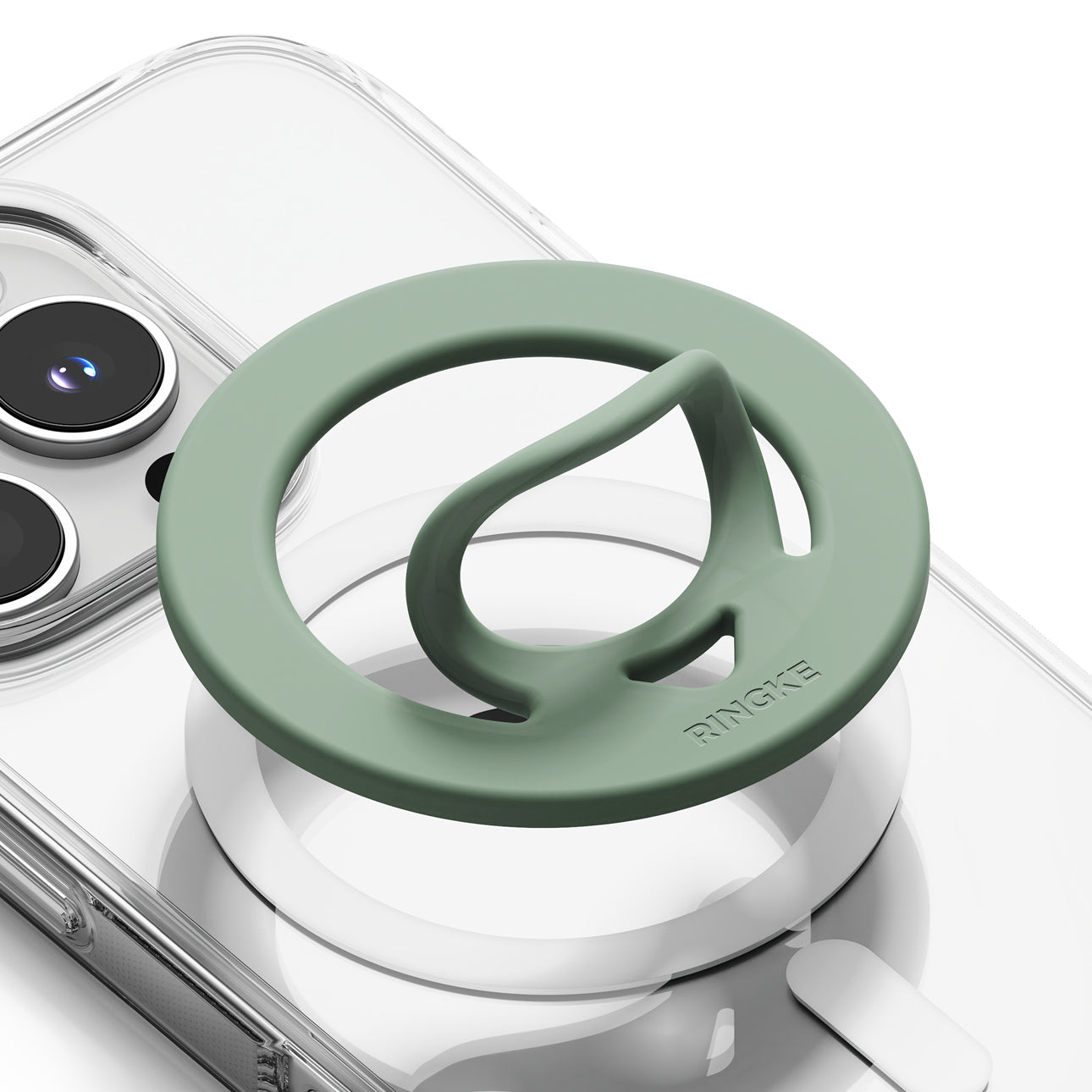 Dual Magnetic Silicone Ring - A sage green Ringke magnetic phone grip mount attached to a clear phone case, shown on a white background.
