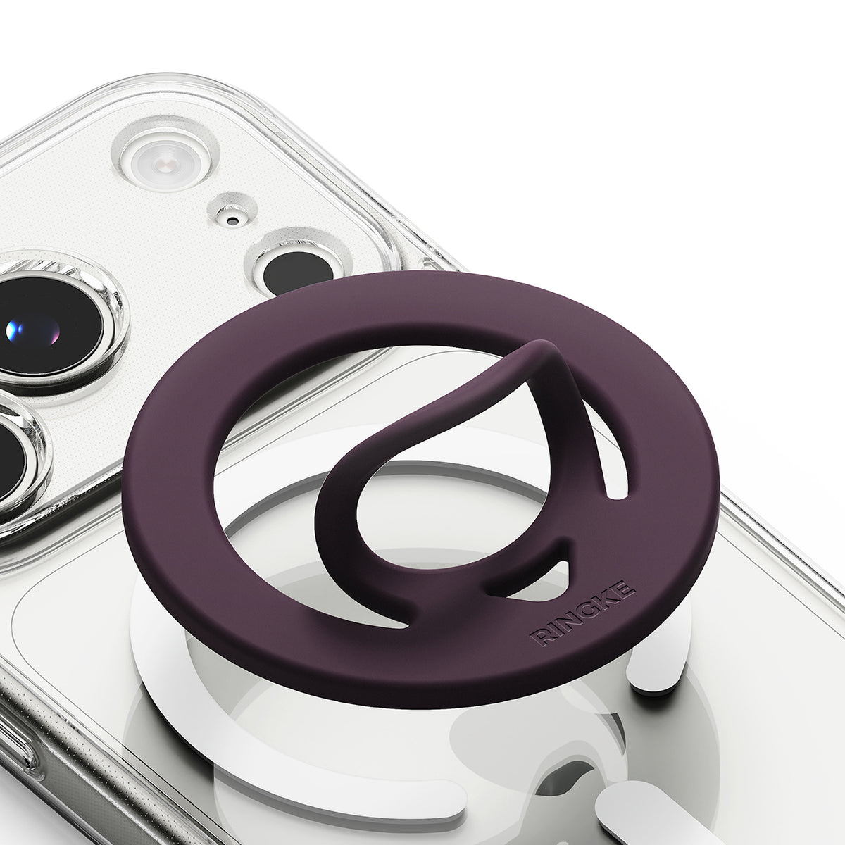 Dual Magnetic Silicone Ring - A dark purple silicone phone grip accessory with a thumb loop, shown attached to a clear phone case on a white background.
