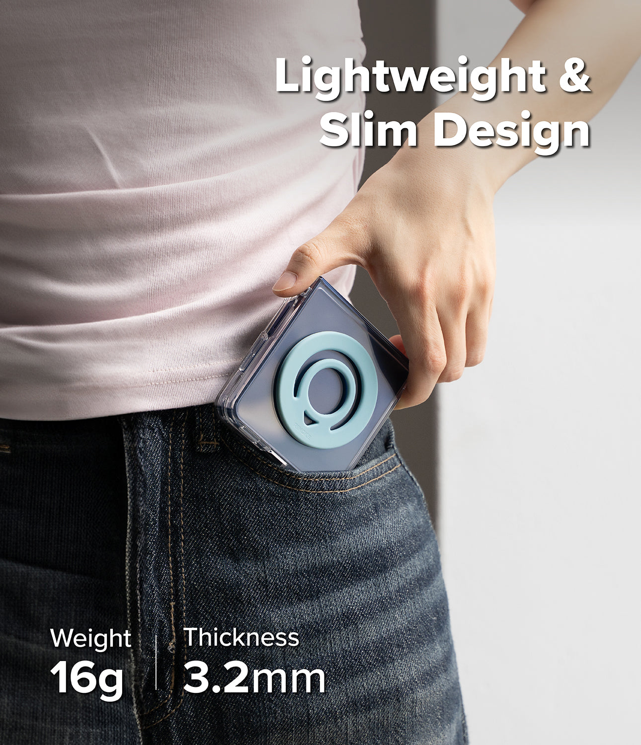 Dual Magnetic Silicone Ring - A hand slides a phone with a light blue magnetic ring into a dark denim pocket.