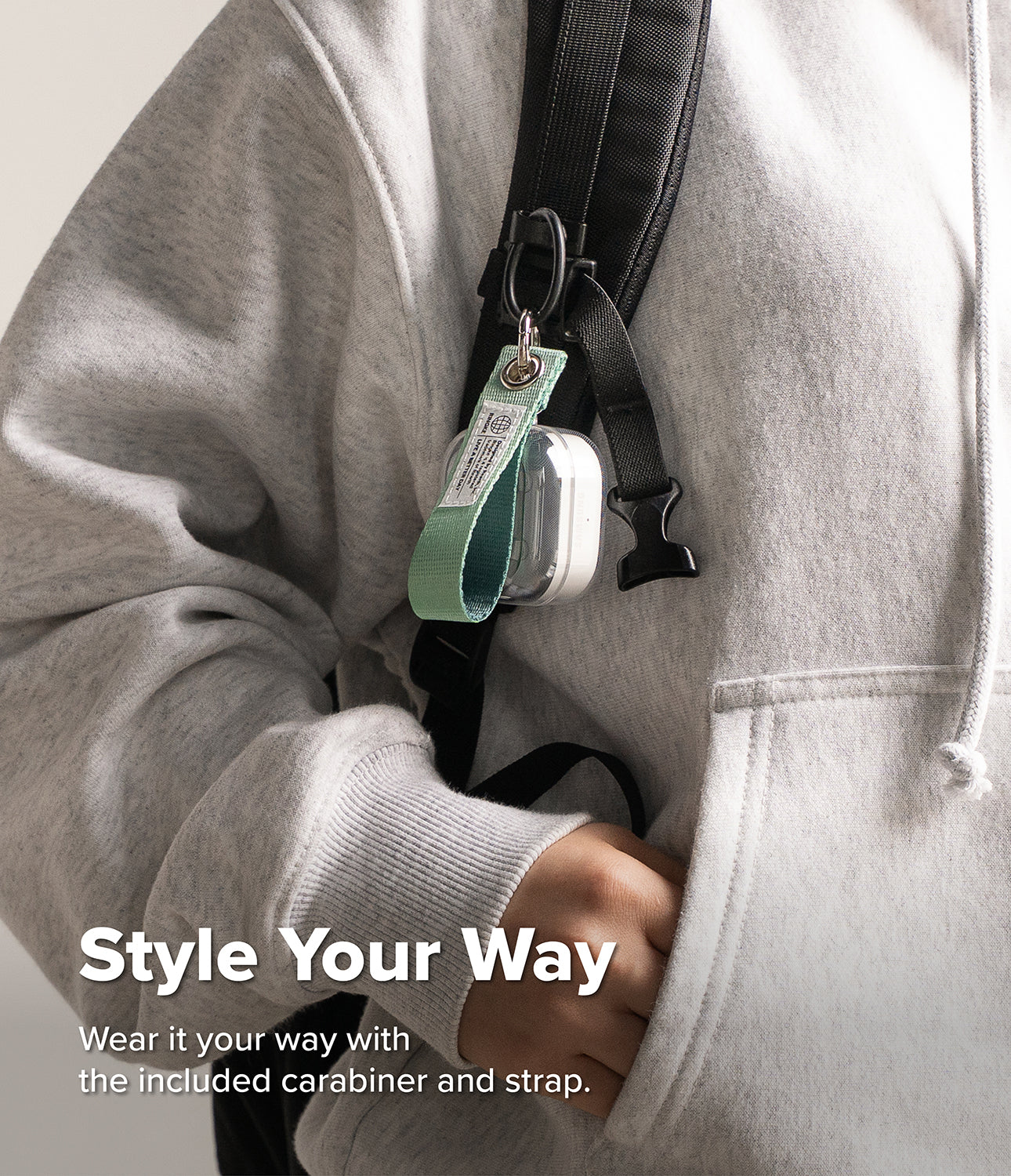 Galaxy Buds 4 Pro / 4 Case | Air - Clear earbud case with a green fabric strap hanging from a backpack strap.