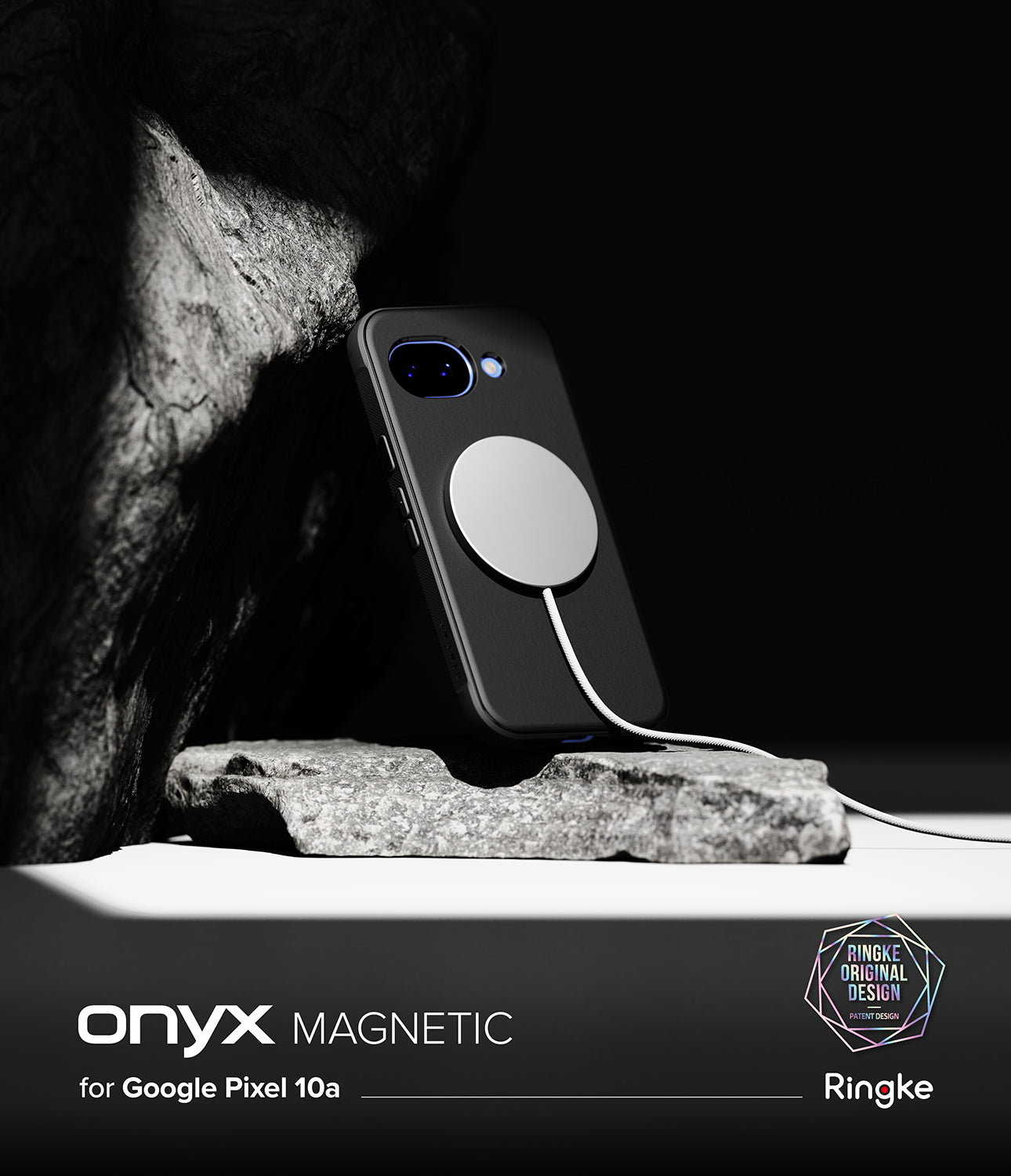 Ringke Onyx Magnetic black rugged case with magnetic charger on a rock against a dark background.