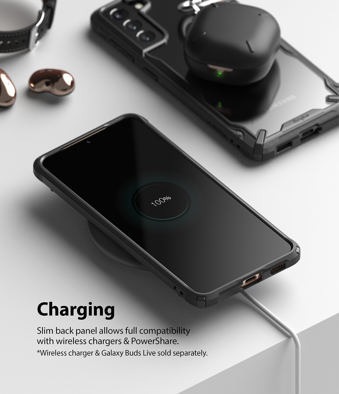 Galaxy S21 Plus Case | Fusion-X - Phone in a black case charging wirelessly with earbuds on a second phone nearby.