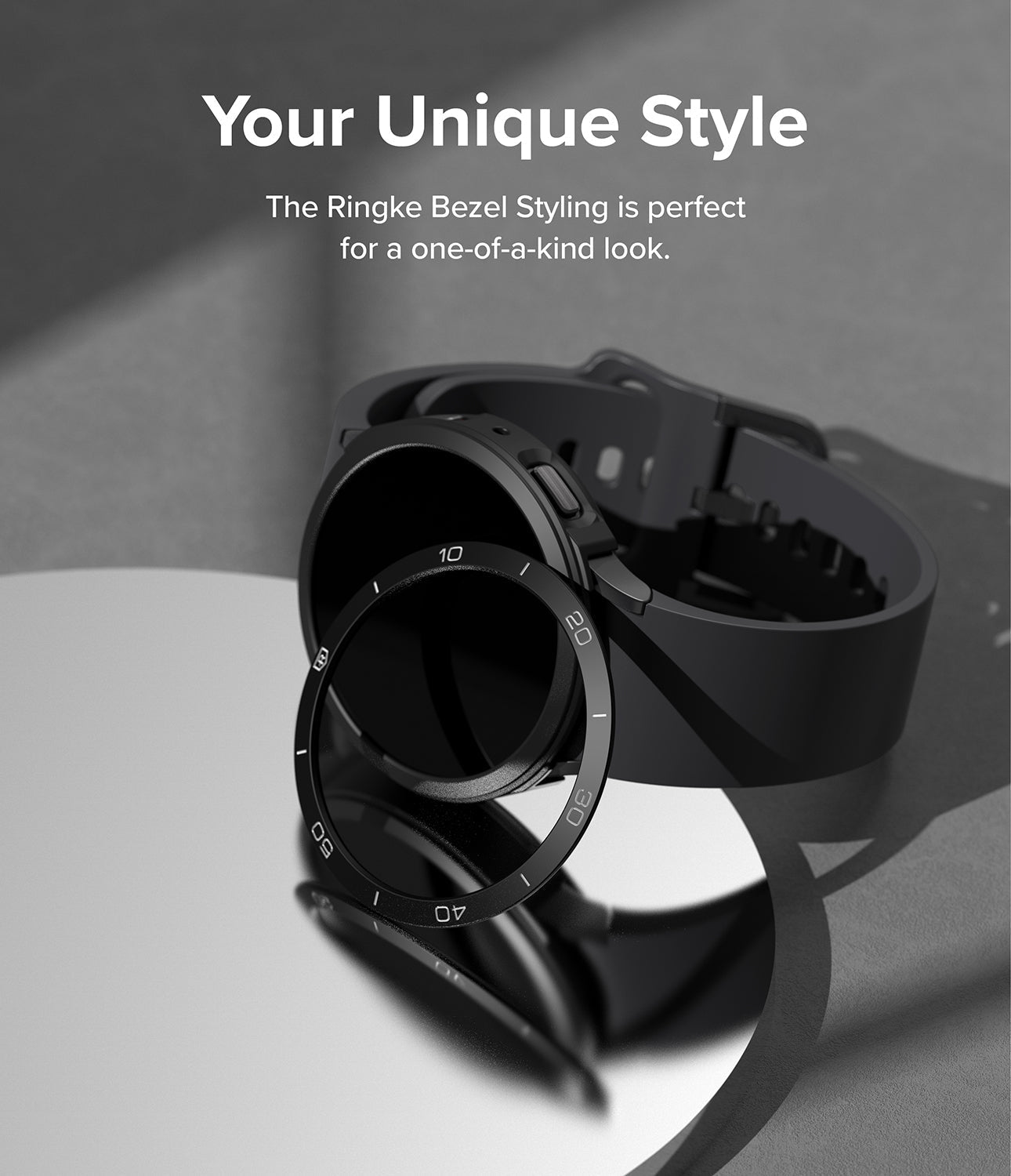 Galaxy Watch 5 44mm | Air Sports Black + Bezel Styling - Black smartwatch with a detached numbered bezel ring on a mirror.