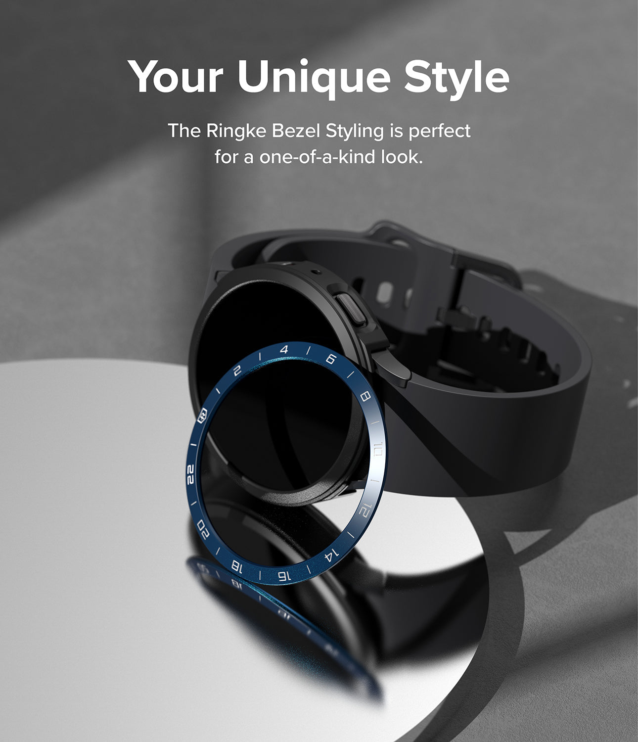 Galaxy Watch 5 44mm | Air Sports Black + Bezel Styling - Black smartwatch with a blue numbered bezel ring on a mirror.