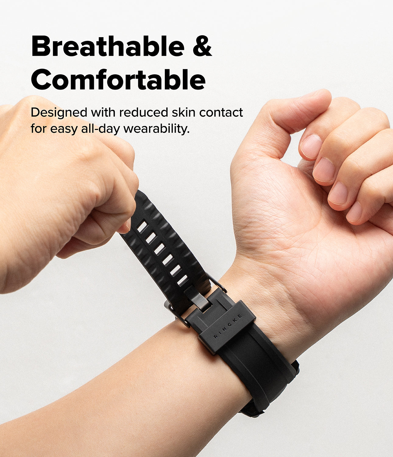 Galaxy Watch 8 Classic 46mm Case + Band | Rugged Gear - Hands fastening a black, textured, breathable watch strap.