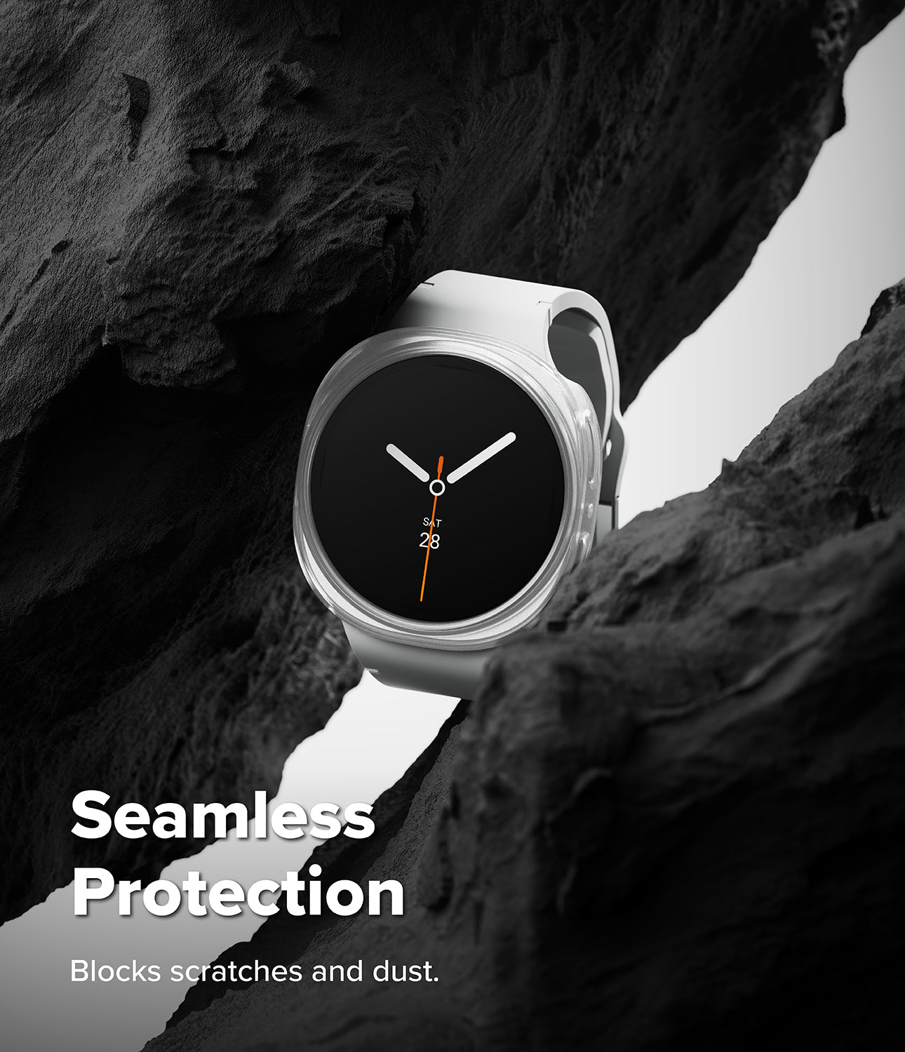 Galaxy Watch 8 40mm Case | Slim - A white smartwatch with a black round face is shown nestled between dark rock formations. White text at the bottom reads 'Seamless Protection' and 'Blocks scratches and dust.