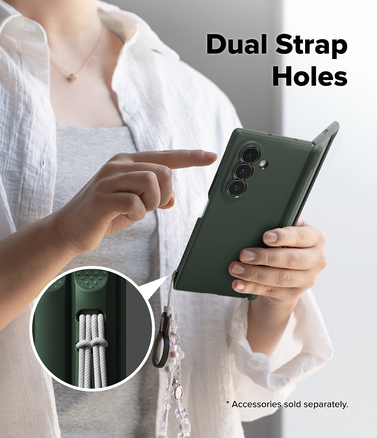 Galaxy Z Fold 8 Ultra Case | Onyx Flap Magnetic - A person holds a dark green phone case with a strap attached, pointing to a circular inset showing the dual strap holes. The text 'Dual Strap Holes' appears at the top, and a note says accessories are sold separately.