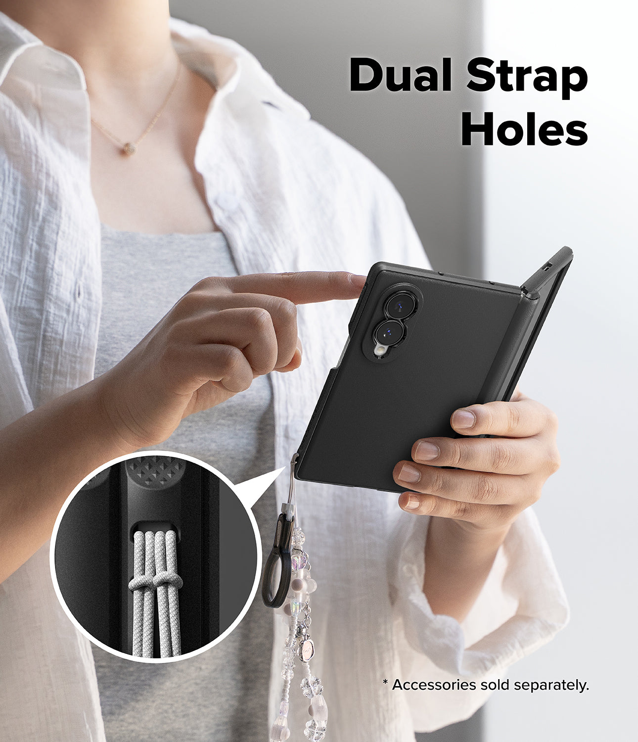 Galaxy Z Fold 8 Case | Onyx Flap Magnetic - A person holds a black foldable phone case with a dangling strap and ring, demonstrating dual strap holes. A circular inset shows the strap attachment detail.