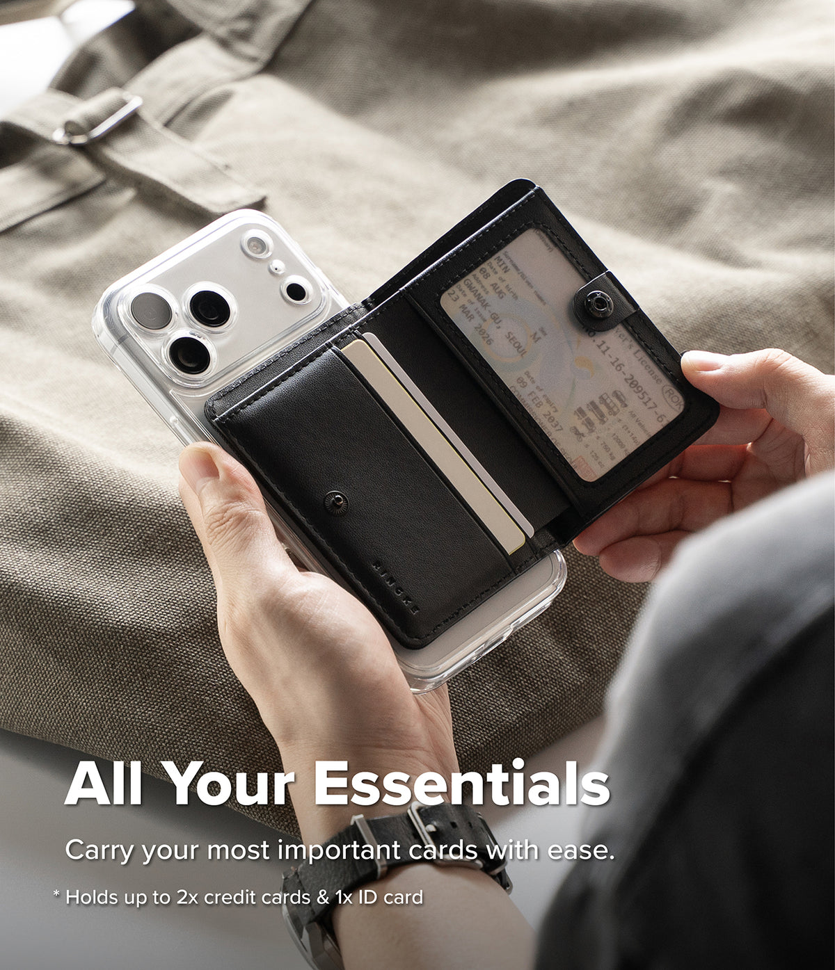 Wallet | Tech Magnetic - A person holds an open black leather wallet phone case with a clear phone case and cards visible inside, set against a beige fabric background with promotional text at the bottom.