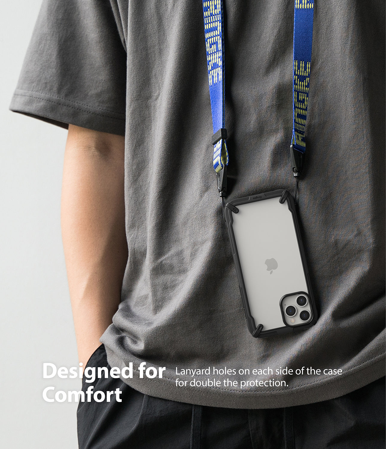 iPhone 12 / 12 Pro Case | Fusion-X - A person wearing a phone in a black protective case hanging from a blue neck lanyard.