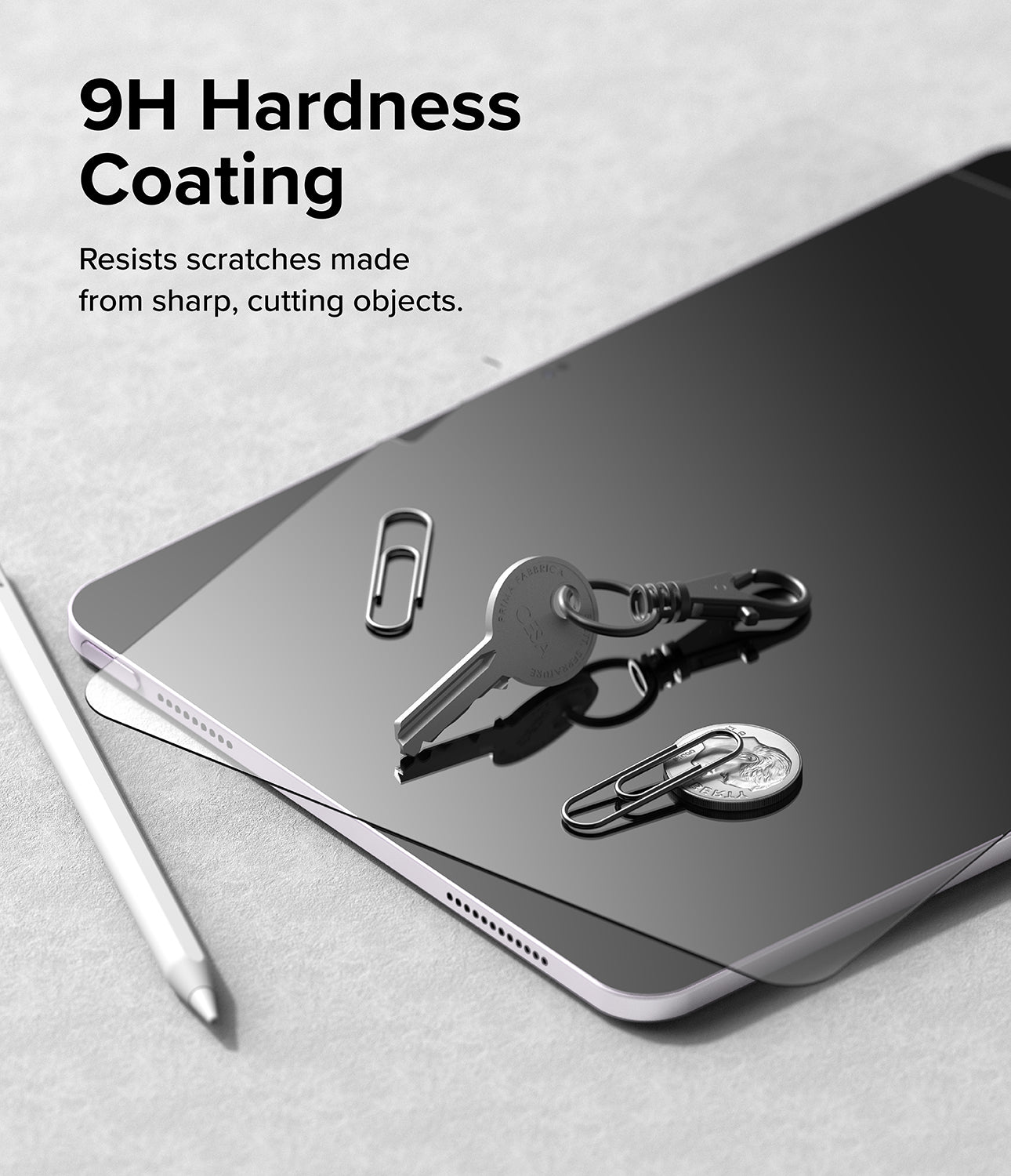 Easy Slide Tempered Glass | iPad - A key, coin, and paperclips resting on an iPad screen to demonstrate scratch resistance.