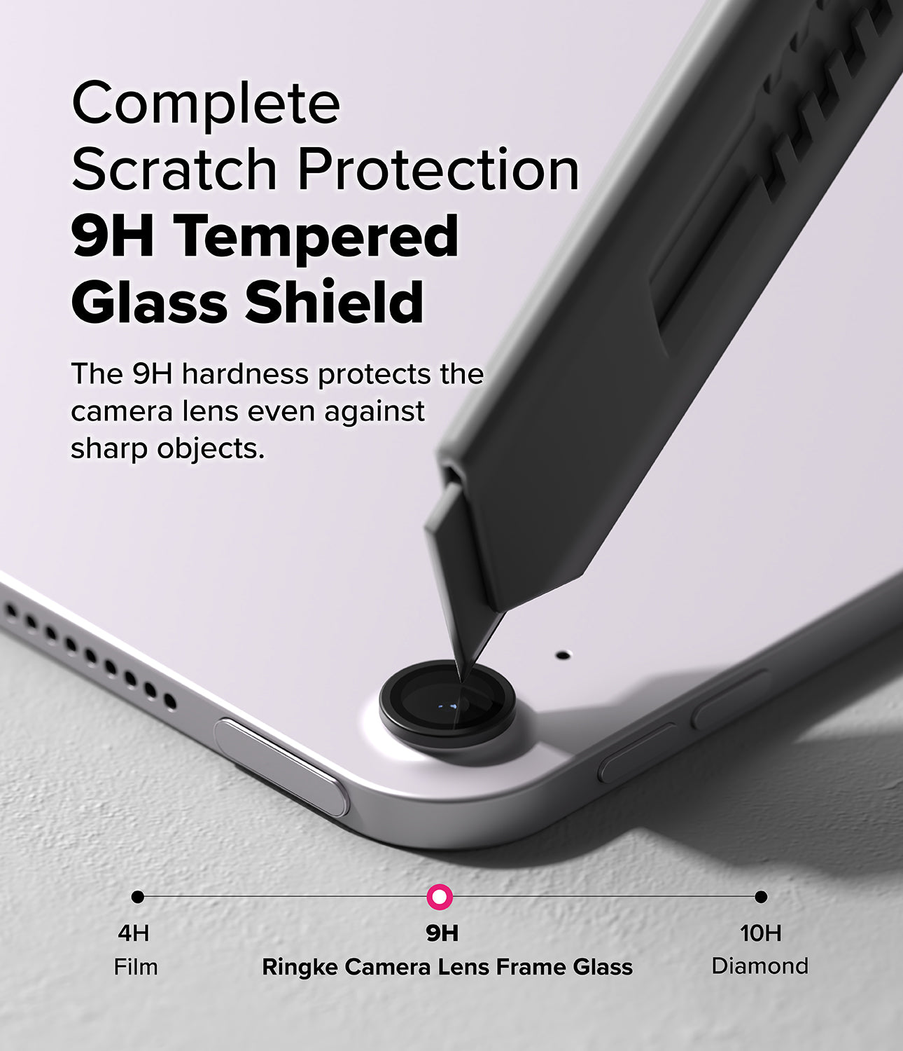 Camera Lens Frame Glass | iPad - A utility knife blade presses against a protective lens cover on an iPad camera.