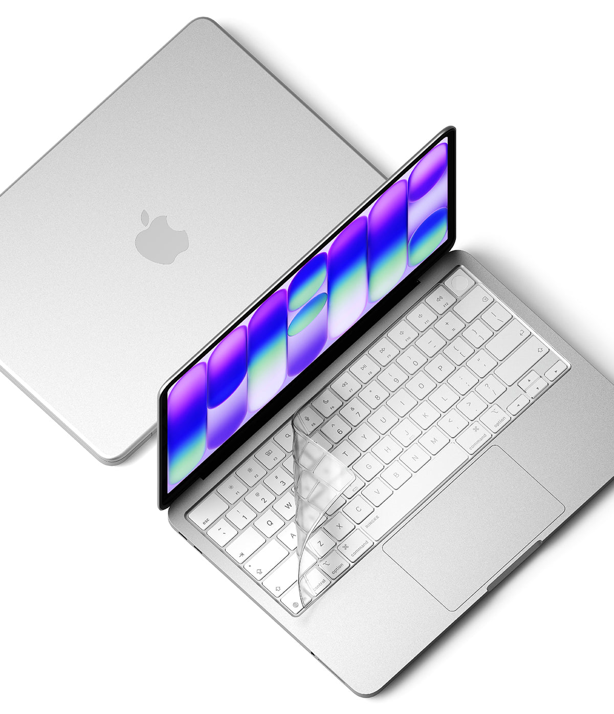 MacBook Neo | Keyskin - A silver Apple laptop with an open screen displaying a colorful wallpaper and a transparent keyboard cover, shown alongside a closed view of the same laptop on a clean white background.
