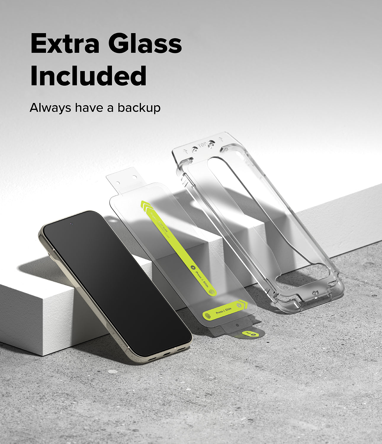 Pixel 11 Pro XL Screen Protector | Easy Slide Tempered Glass (2 Pack) - A clear phone case and two extra glass screen protectors are displayed on white blocks next to a black smartphone, with the text 'Extra Glass Included' and 'Always have a backup' in the upper left.