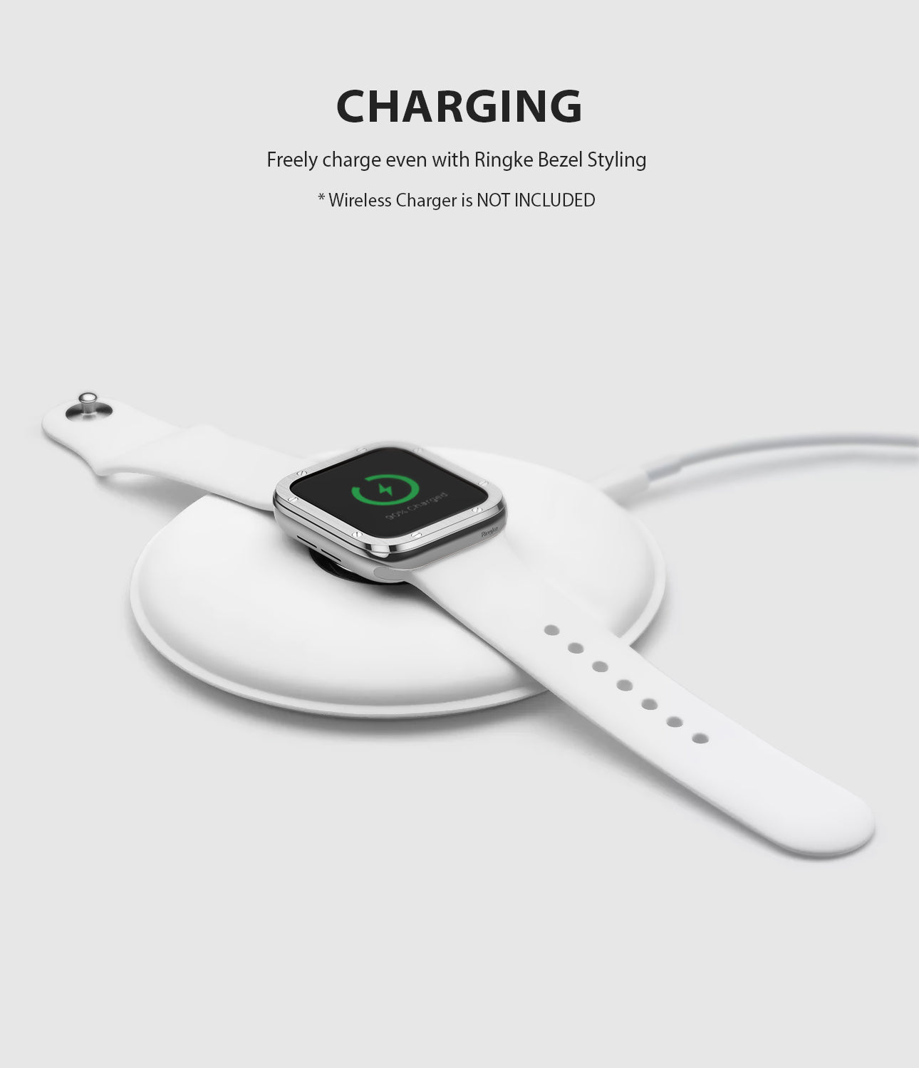 Apple Watch Series 6 / 5 / 4 / SE (44mm) | Premium Bezel Styling H - Apple Watch with silver bezel styling charging on a pad.