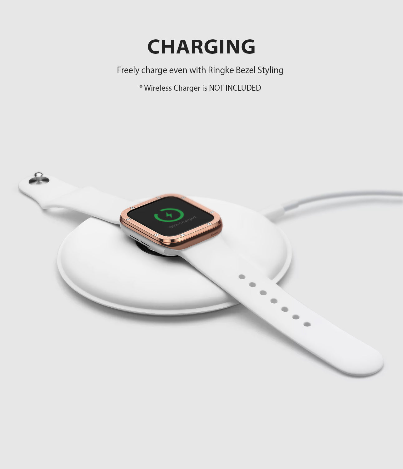 Apple Watch Series 6 / 5 / 4 / SE (44mm) | Premium Bezel Styling H - Rose gold bezel on white Apple Watch charging.