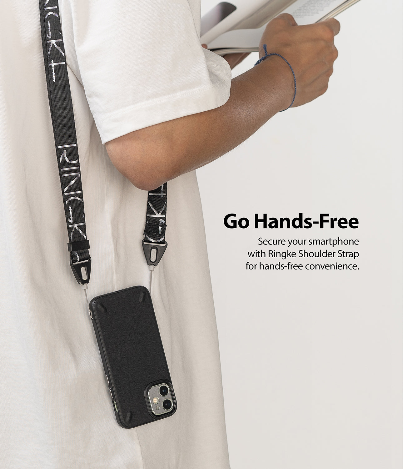 Shoulder Strap | Lettering - Person wearing a black phone case on a branded black and white shoulder strap with text overlay.