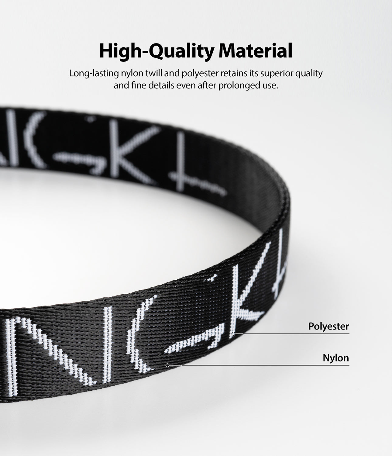 Shoulder Strap | Lettering - Close-up of a black nylon strap with white lettering, highlighting its durable material construction.