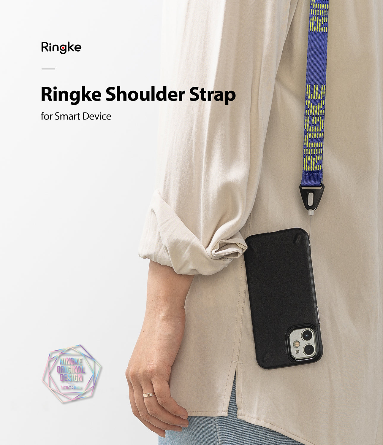 Shoulder Strap | Lettering - Person wearing a blue shoulder strap with yellow lettering attached to a black smartphone case.