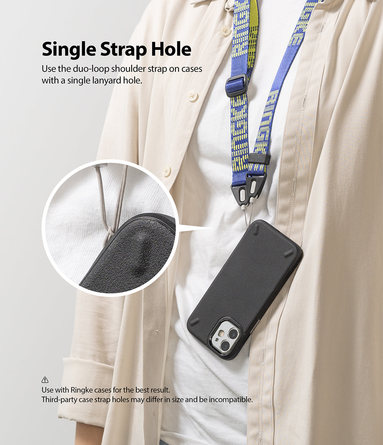 Shoulder Strap | Lettering - A blue and yellow patterned strap attached to a black phone case via a single lanyard hole.