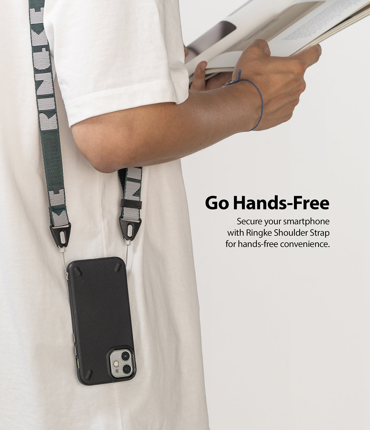 Shoulder Strap | Lettering - Person wearing a dark green Ringke shoulder strap with white lettering attached to a black smartphone.