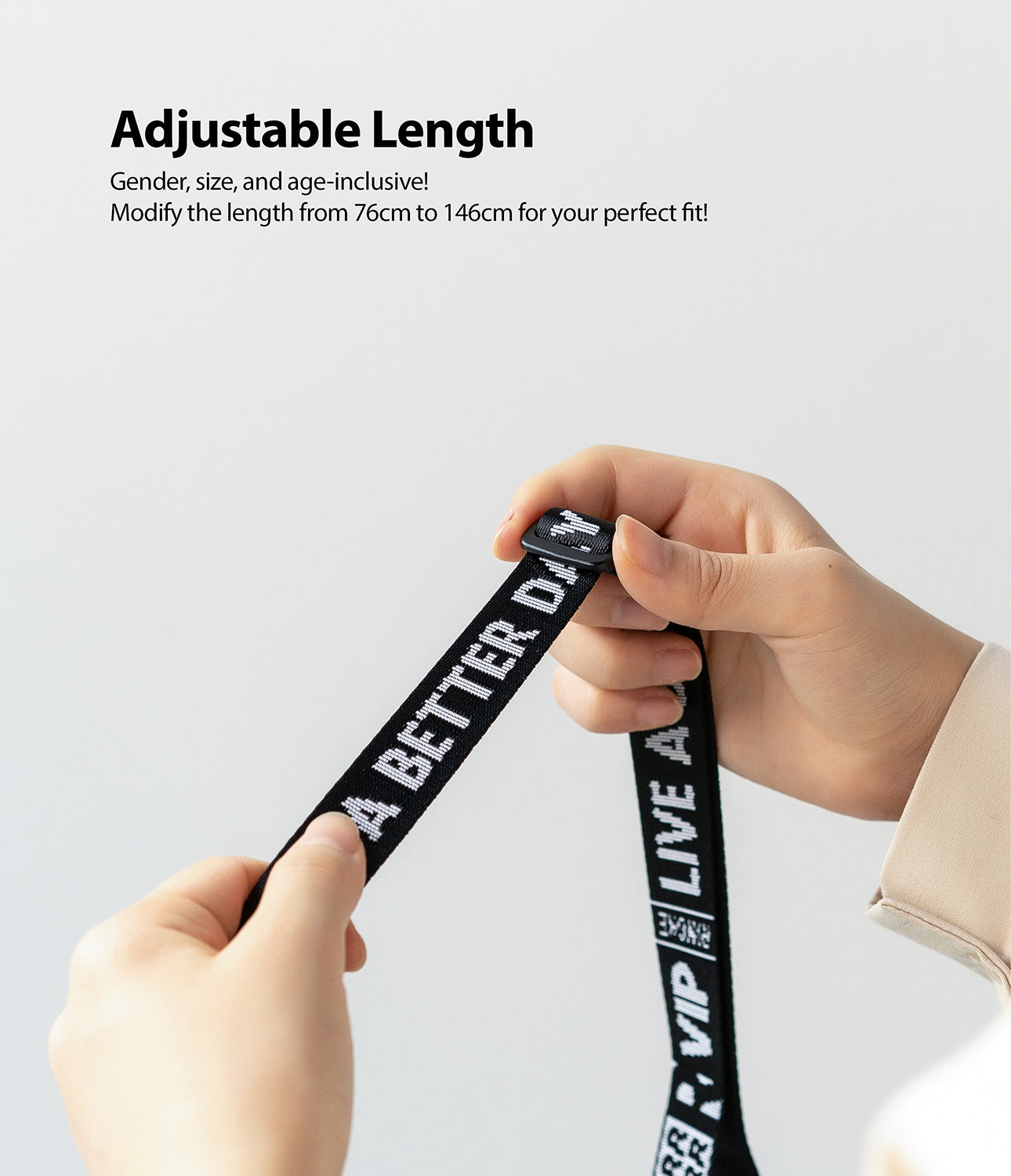 Shoulder Strap | Lettering - Hands adjusting a black strap with white text reading A BETTER DAY and LIVE A VIP.