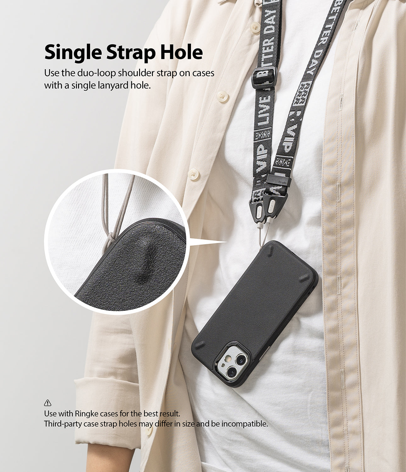 Shoulder Strap | Lettering - A black phone case with a branded shoulder strap attached to a single lanyard hole via a duo-loop.