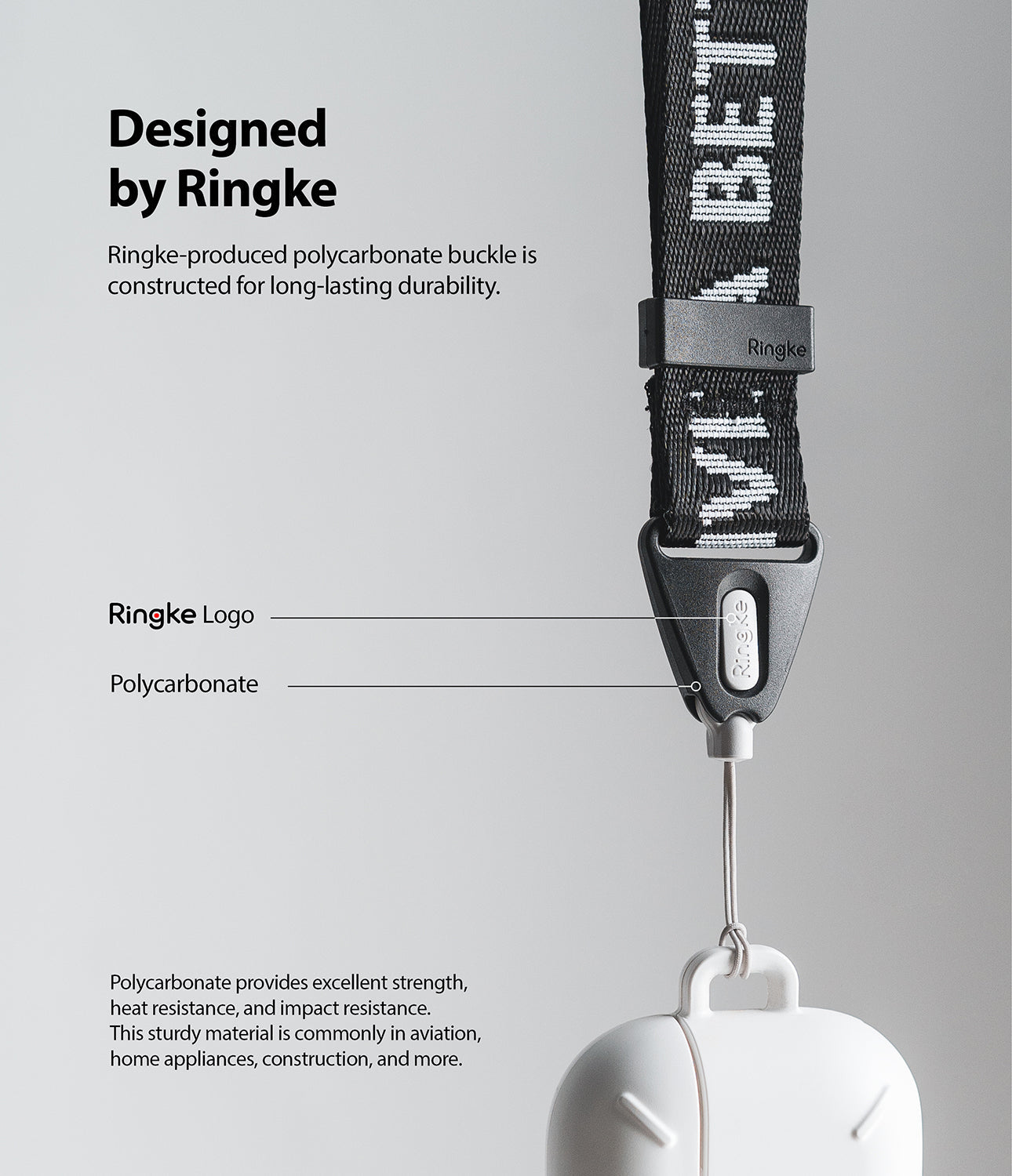 Shoulder Strap | Lettering - Close-up of a black branded shoulder strap with a durable polycarbonate buckle and logo.