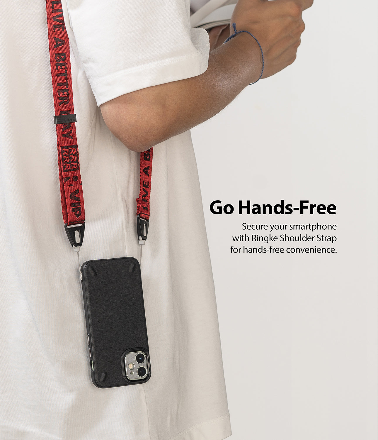 Shoulder Strap | Lettering - Person wearing a red strap with black lettering attached to a black smartphone case.
