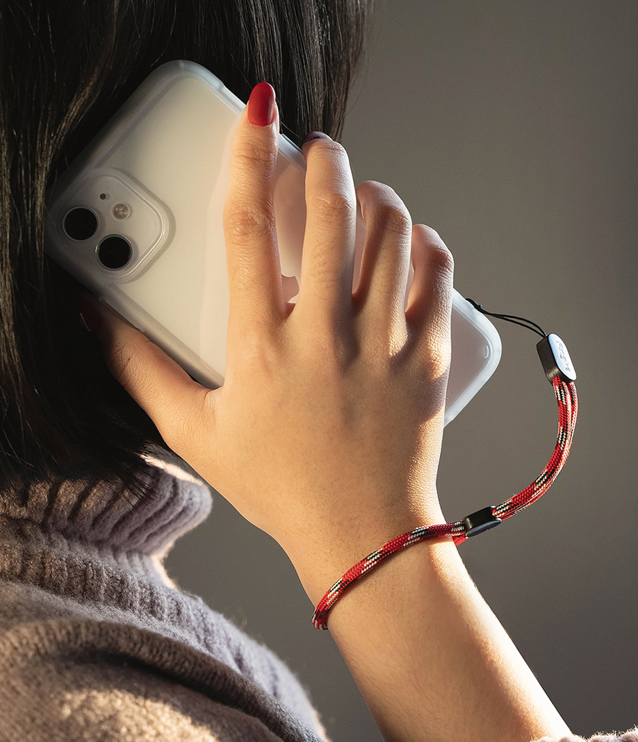 ringke paracord wrist strap when attached to a smartphone case