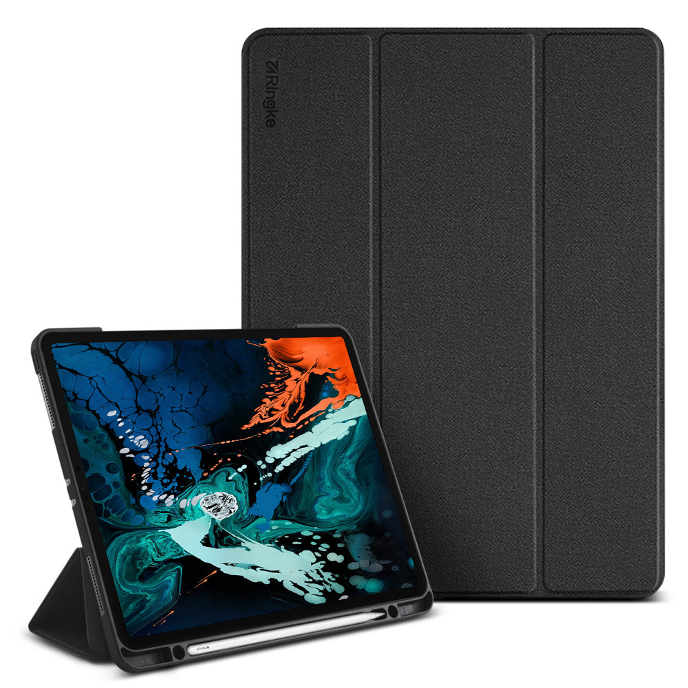 Smart Cover Apple Pencil Stand | iPad - A black textured folio-style tablet case shown with a tablet in front of it on a white background. The case has a tri-fold design, with the back cover standing upright and the front cover propped open to display the tablet screen.