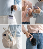 Holder Link Puffer | Finger - Four panels showing puffer-style finger straps attached to phones, earbuds, and bags.