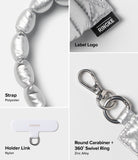Holder Link Puffer | Hand - Product details of a silver keychain with strap, holder link, round carabiner, and 360 swivel ring on a white background.