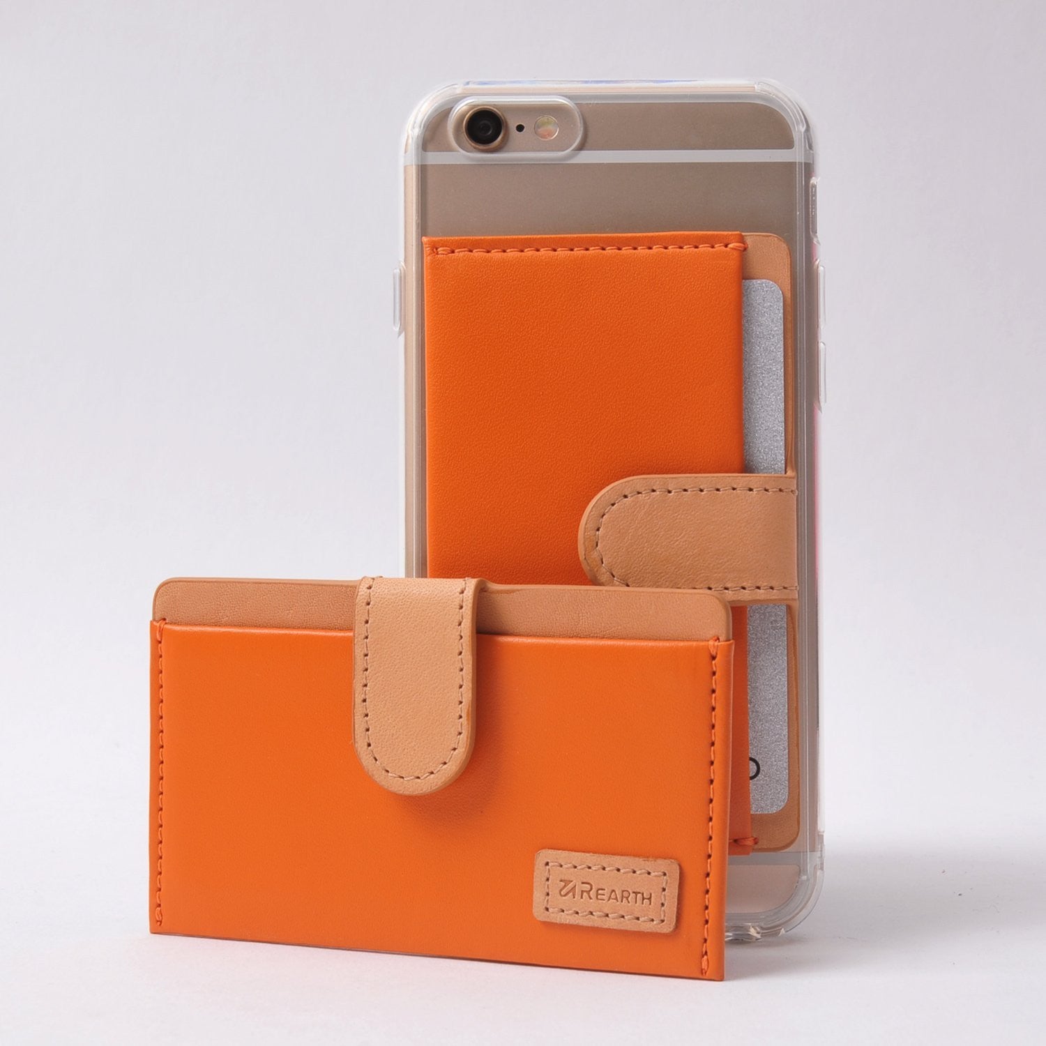 Ringke® Leather ID / Card Holder, 3M Adhesive Stick On Mini Wallet Attachment for All Phone Devices - Ringke® Leather ID / Card Holder - Orange leather card holder with tan strap, attached to a phone and standing alone.