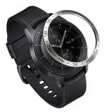 Galaxy Watch (42mm) | Bezel Styling - A black smartwatch with a silver tachymeter bezel ring hovering above the watch face.