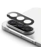 Galaxy A37 / A57 5G | Camera Glass 2P - Protective glass cover hovering above the triple camera lenses of a silver smartphone.