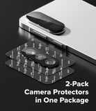Galaxy A37 / A57 5G | Camera Glass 2P - Two black camera lens protectors on a backing sheet next to a smartphone.