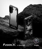 [Bundle] Galaxy A57 | Fusion-X - Two Galaxy A57 Fusion-X cases, one clear and one camo, displayed on dark, rugged rock.