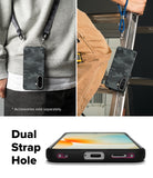 Galaxy A57 5G Case | Onyx - Black camo phone case shown worn with straps and highlighting the dual strap hole design.