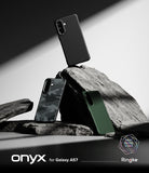 Galaxy A57 5G Case | Onyx - Three Galaxy A57 cases in black, camo, and green displayed on jagged rocks against a white background.