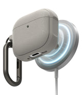 AirPods 4 Case | Onyx Magnetic - Textured grey AirPods 4 case magnetically attached to a glowing wireless charger.