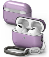 AirPods Pro 2 Case | Layered - Multiple AirPods Pro 2 cases in black, white, and purple displayed on geometric blocks.