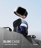 Apple Watch 12 46mm | Slim (2P) - Three slim protective cases for Apple Watch 12, 42mm are shown floating above a concrete ledge against a pale blue sky. The cases are in light pink, dark gray, and black, with the center case fitted on a watch.