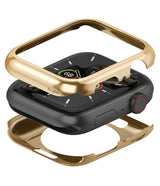 Apple Watch Series 6 / 5 / 4 / SE (44mm) | Full Frame - Gold protective case components hovering over a black Apple Watch.