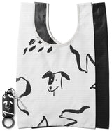 Day-Me Bag - White reusable tote with black hand-drawn dog illustrations and a matching compact storage pouch with keychain.